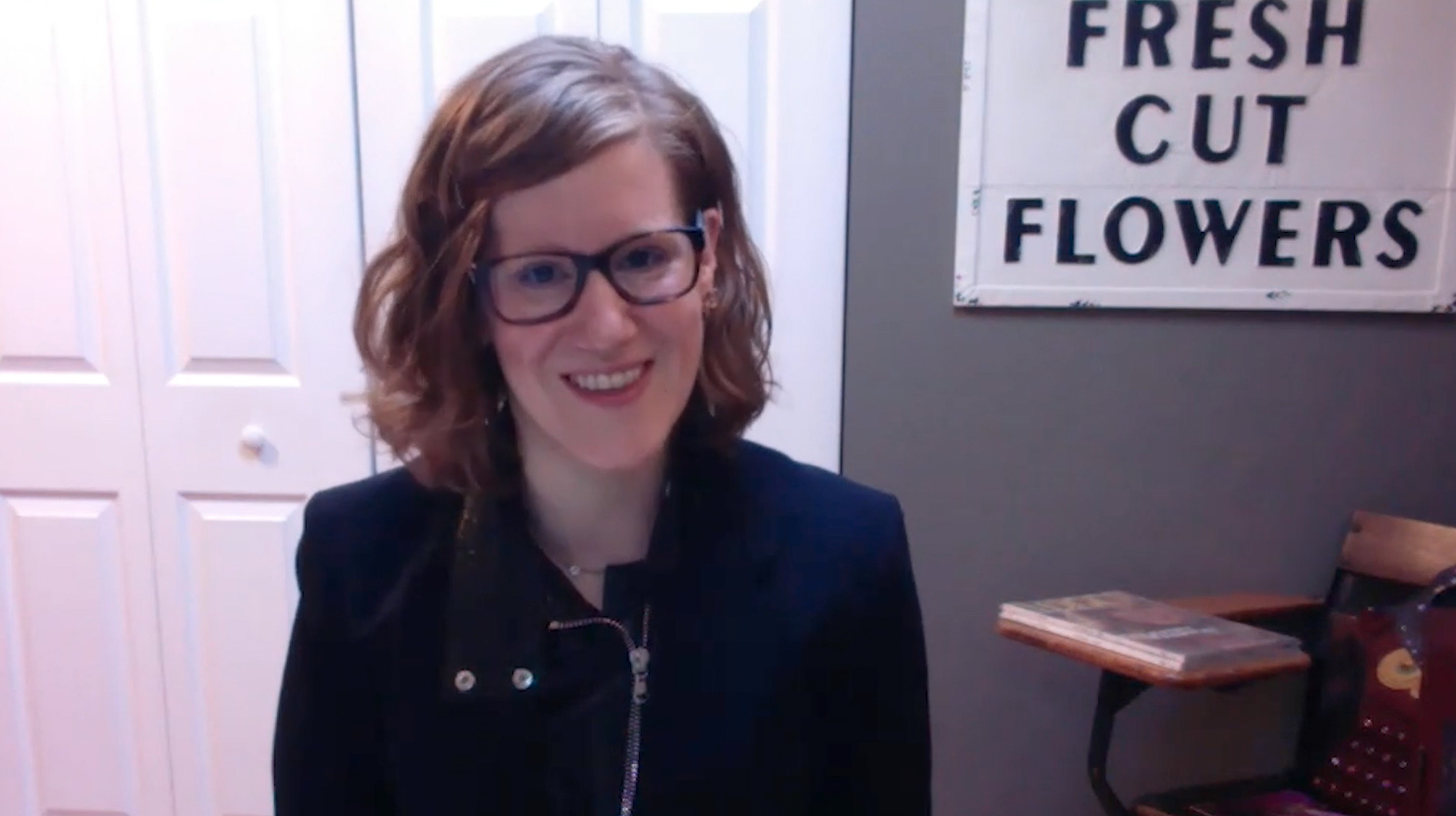 Professor Stacy Neier Beran smiling in her home office.